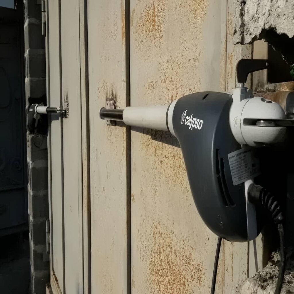 نصب جک درب پارکینگ اتوماتیک دهانه عریض در ملارد