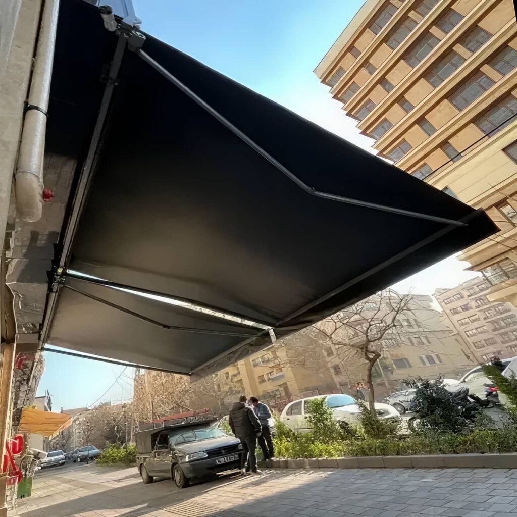 سایبان برقی بازویی با پوشش مقاوم